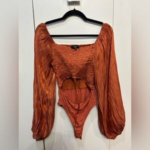 Lulu’s Copper Orange Satin Long Sleeved Bodysuit With Midriff Cutout